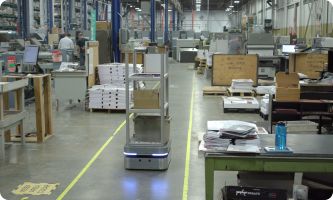 autonomous mobile robots moving materials in a warehouse