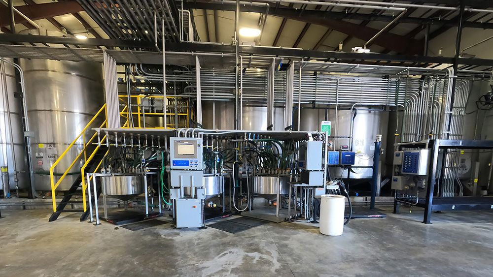 Industrial pump system connected to storage tank and piping used for fluid movement