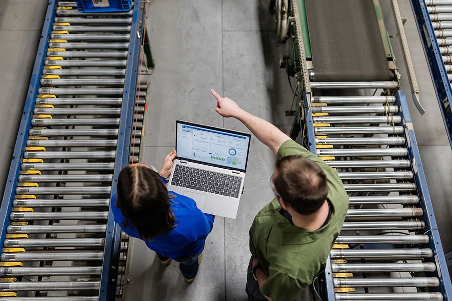 Automated material handling equipment operating on a clean, modern OEM production line with robotics and conveyor systems.