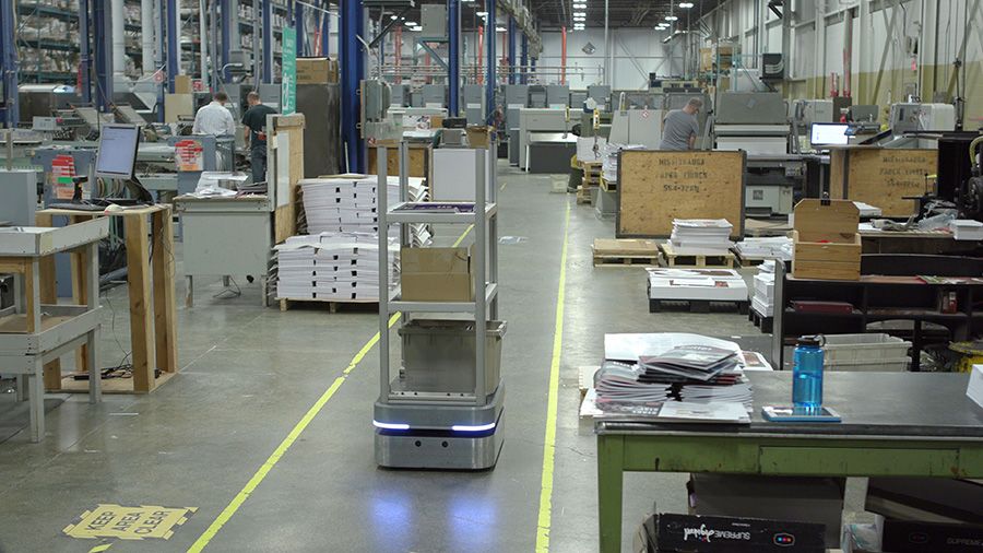 OTTO 100 autonomous mobile robot delivering materials to reduce manual labor and improve workforce retention.
