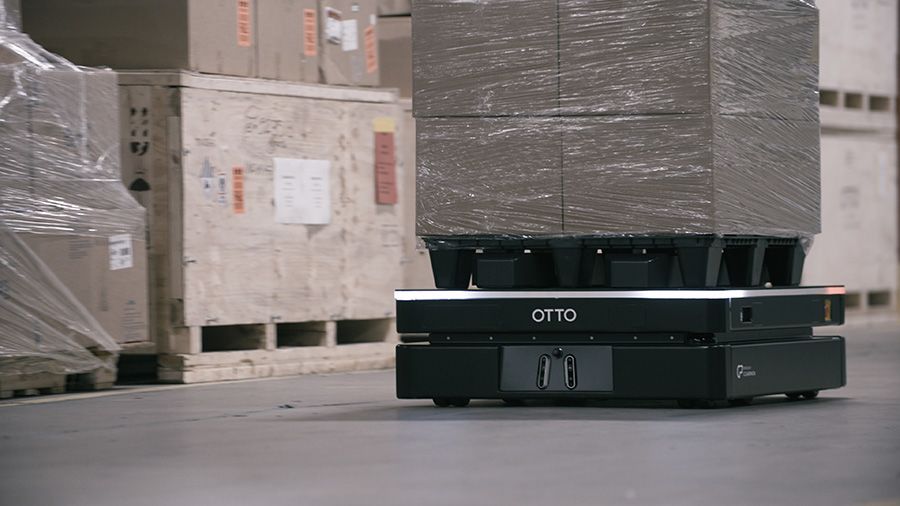 OTTO 1200 autonomous mobile robot moving a palletized payload to increase throughput and production efficiency.