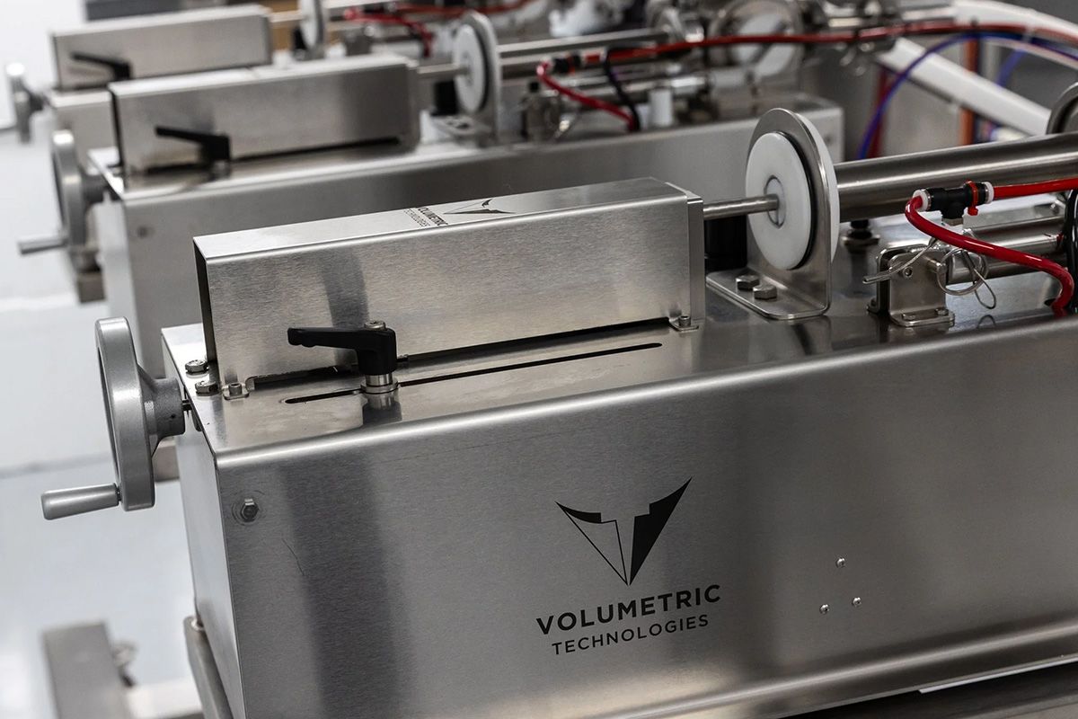 Industrial liquid filling equipment designed and built by Volumetric Technologies in the Midwest for precise, high‑speed manufacturing applications.

