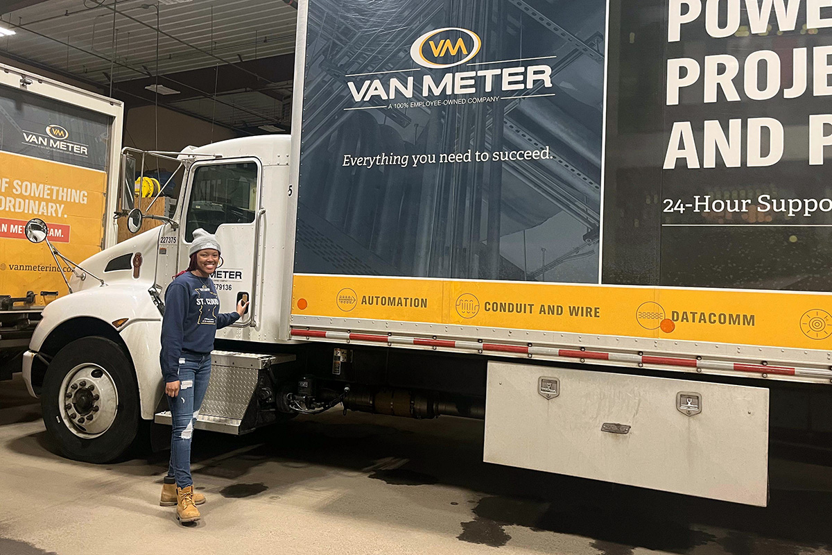 breonna in front of van meter truck